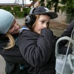 Melinda Parke holds her son, Elijah, 8, as the two watch cars drive down the freeway near their motel room at the Days Inn on Friday in Everett. (Ryan Berry / The Herald)