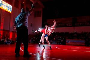 Stanwood's Mason Ferguson is lifted off the mat by Arlington's Trevor Latta in the 182lb weight class at Stanwood High School Thursday evening in Stanwood, Washington on January 6, 2022. The Spartans defeated the Eagles 50-21.  (Kevin Clark / The Herald)