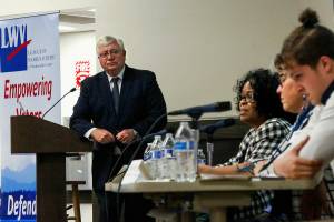 While emcee Bob Drewel and panelists Cameron Calder (right) and Kathy Coffey listen, panelist Janice Green (center) speaks Wednesday night at the League of Women Voters of Snohomish County's Civil Discourse Forum held in the Wilderness Room of the Jackson Center at EvCC.  (Dan Bates / The Herald)