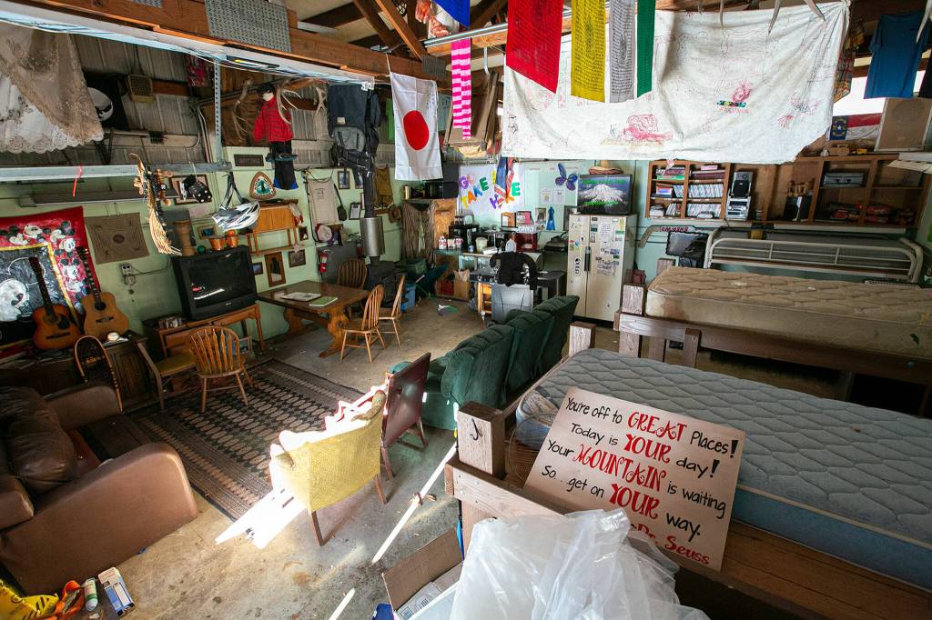Light shines through the front door of the Dinsmores Hiker Haven in Baring. (Ryan Berry / The Herald)