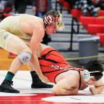 Arlingtons Trevor Latta wrestles Monroes Brian Zebley Jr. on Saturday evening during the 3A Regional 1 boys wrestling tournament at Snohomish High School in Snohomish. (Kevin Clark / The Herald)