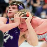 North Thurston’s Bruce Price attempts to fend off Stanwood’s Mason Ferguson Saturday evening during the 3A Regional 1 boys wrestling tournament at Snohomish High School in Snohomish, Washington on February 12, 2022.  (Kevin Clark / The Herald)