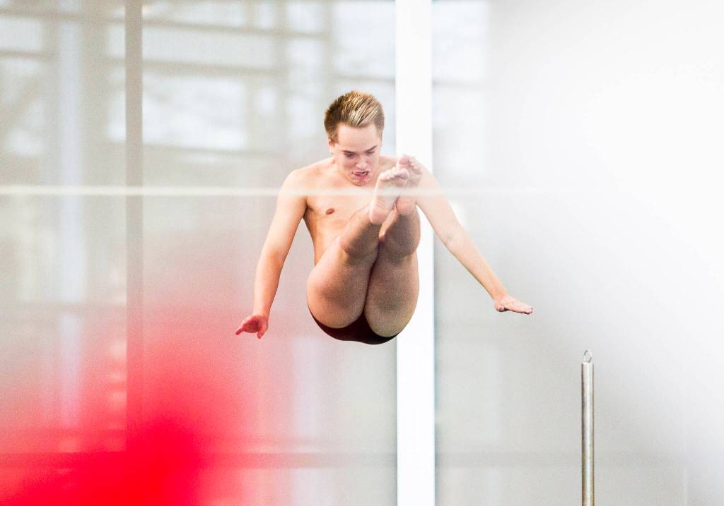 Lake StevensՠJaden Cardona dives during the 4A Boys Districts swim meet on Saturday, Feb. 12, 2022 in Snohomish, Wa. (Olivia Vanni / The Herald)