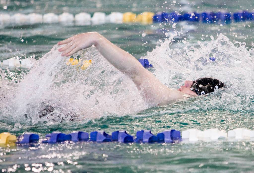 Lake StevensՠGarrett Chesley swims in the 100 Yard Backstroke during the 4A Boys Districts swim meet on Saturday, Feb. 12, 2022 in Snohomish, Wa. (Olivia Vanni / The Herald)