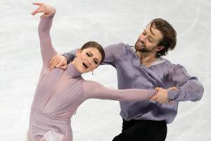 Kaitlin Hawayek and Jean-Luc Baker, of the United States, perform their routine in the ice dance competition during the figure skating at the 2022 Winter Olympics, Monday, Feb. 14, 2022, in Beijing. (AP Photo/Natacha Pisarenko)