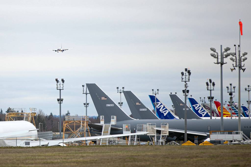 The first scheduled Alaska Airlines Boeing 737 approaches Paine Field for landing Thursday in Everett. (Ryan Berry / The Herald)