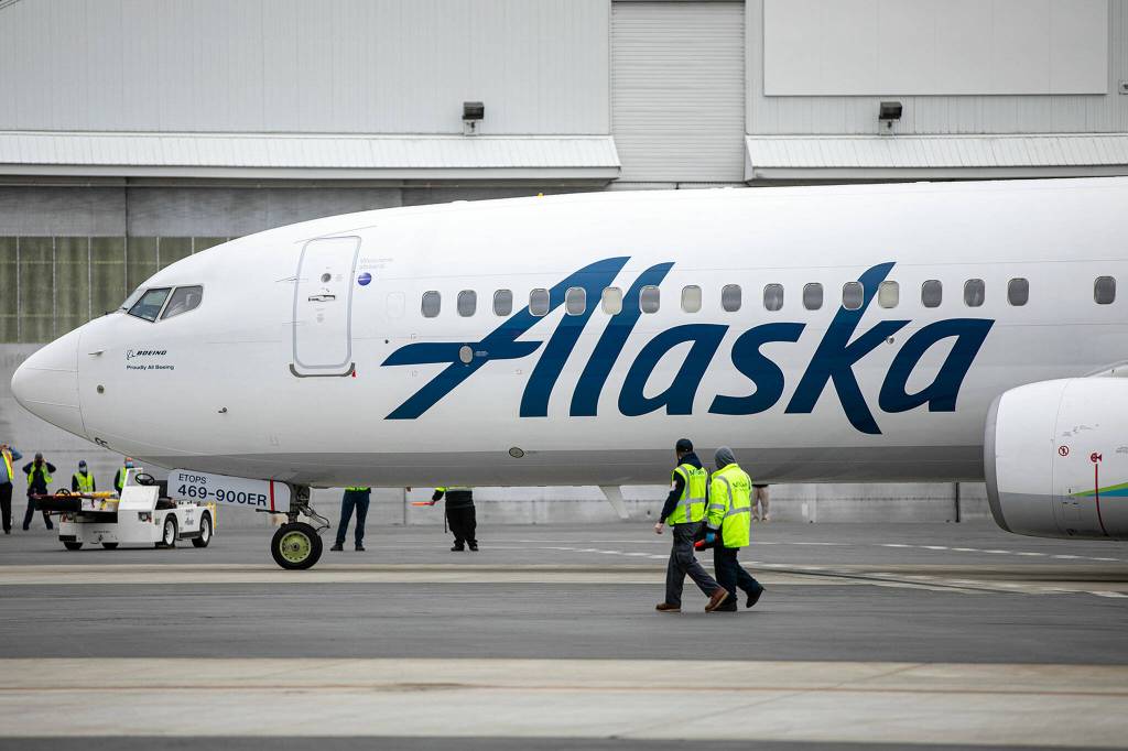 An Alaska Airlines Boeing 737 pulls up to a gate Thursday at Paine Field in Everett. (Ryan Berry / The Herald)