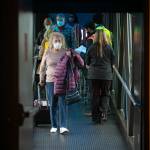 Passengers disembark an Alaska Airlines 737 at Paine Field in Everett on Thursday. The plane, arriving from Phoenix, was the first regularly scheduled 737 to serve passengers at Paine Field. Alaska up to now has deployed smaller Embraer jets to Everett. (Ryan Berry / The Herald)