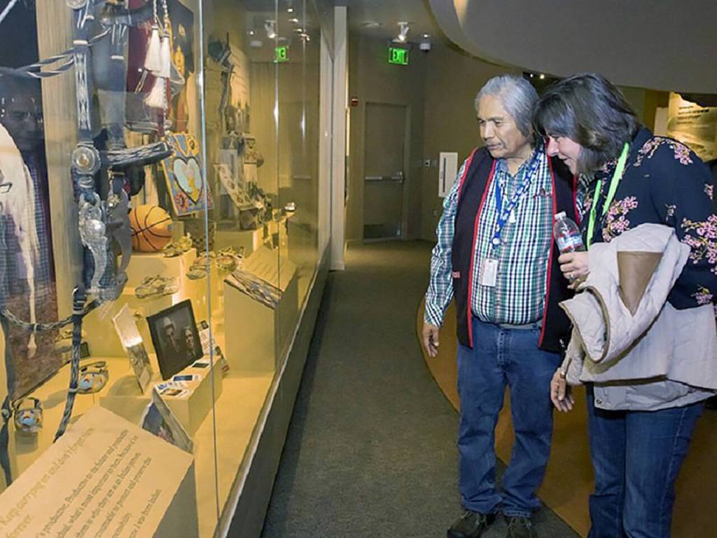 This undated photo shows Wanapum Band Tribal Elder Rex Buck, Jr. and the U.S. Dept of Energy Environmental Management Assistant Secretary Anne White viewing a display of artifacts at the Wanapum Heritage Center. (U.S. Department of Energy)
