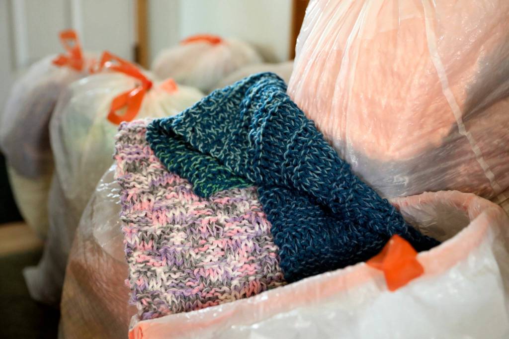 Vicki Wahl of Lake Stevens has been making scarves for for teachers, nursing home residents and unsheltered people for the past 10 years. (Kevin Clark / The Herald )