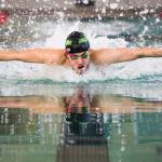 Jacksons Alex Georgiev swims the 100-yard butterfly during the 4A boys district swim meet on Saturday at the Snohomish Aquatic Center. (Olivia Vanni / The Herald)