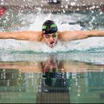 Alex Georgiev swims in the 100 Yard Butterfly during the 4A Boys Districts swim meet on Saturday, Feb. 12, 2022 in Snohomish, Wa. Georgiev won the 100 Yard Butterdly and set a new meet record. (Olivia Vanni / The Herald)