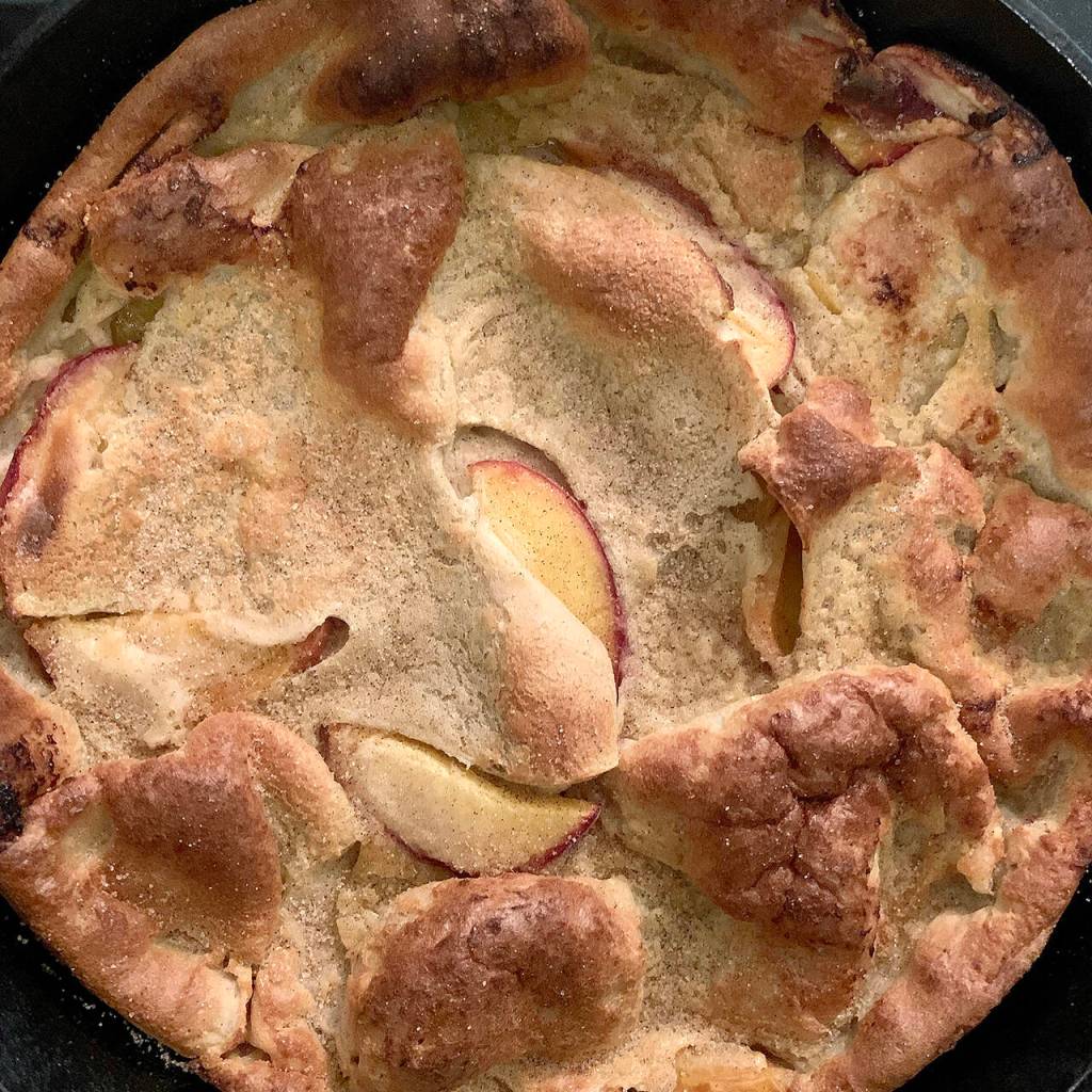 Reporter Taylor Goebel made this peach Dutch baby (recipe from Half Baked Harvest) for her friends after a harrowing hiking excursion in New Hampshires White Mountains. (Taylor Goebel / The Herald)