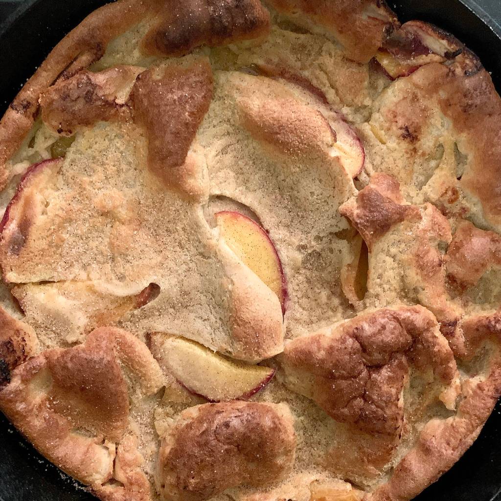 Reporter Taylor Goebel made this peach Dutch baby (recipe from Half Baked Harvest) for her friends after a harrowing hiking excursion in New Hampshire’s White Mountains. (Taylor Goebel / The Herald)