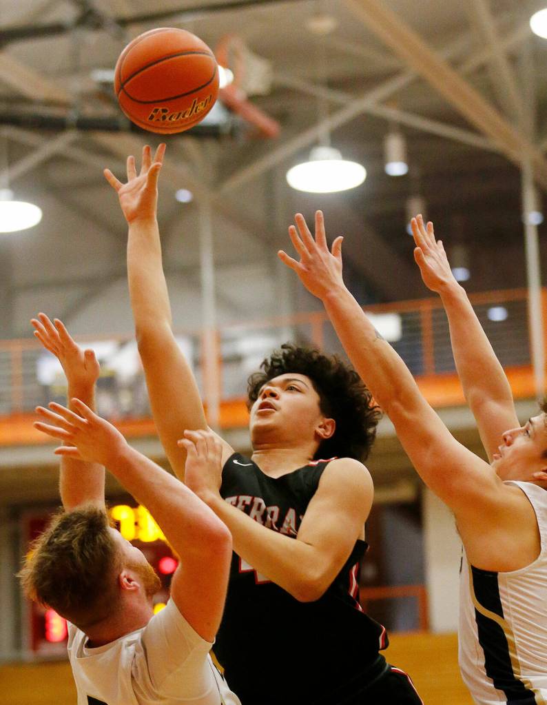 Don Brown sinks a basket in the paint for the Hawks. (Ryan Berry / The Herald)