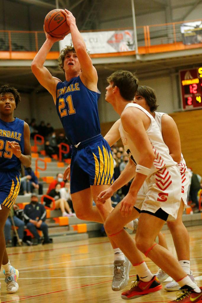 Ferndales Conner Walcker hits a spinning shot against Stanwood during a 3A District 1 Tournament semifinal game on Wednesday at Everett Community College. (Ryan Berry / The Herald)