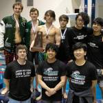 The Jackson boys swimming team celebrates third place during the WIAA 4A Boys Swimming Championship on Saturday at the King County Aquatic Center in Federal Way. (Ryan Berry / The Herald)