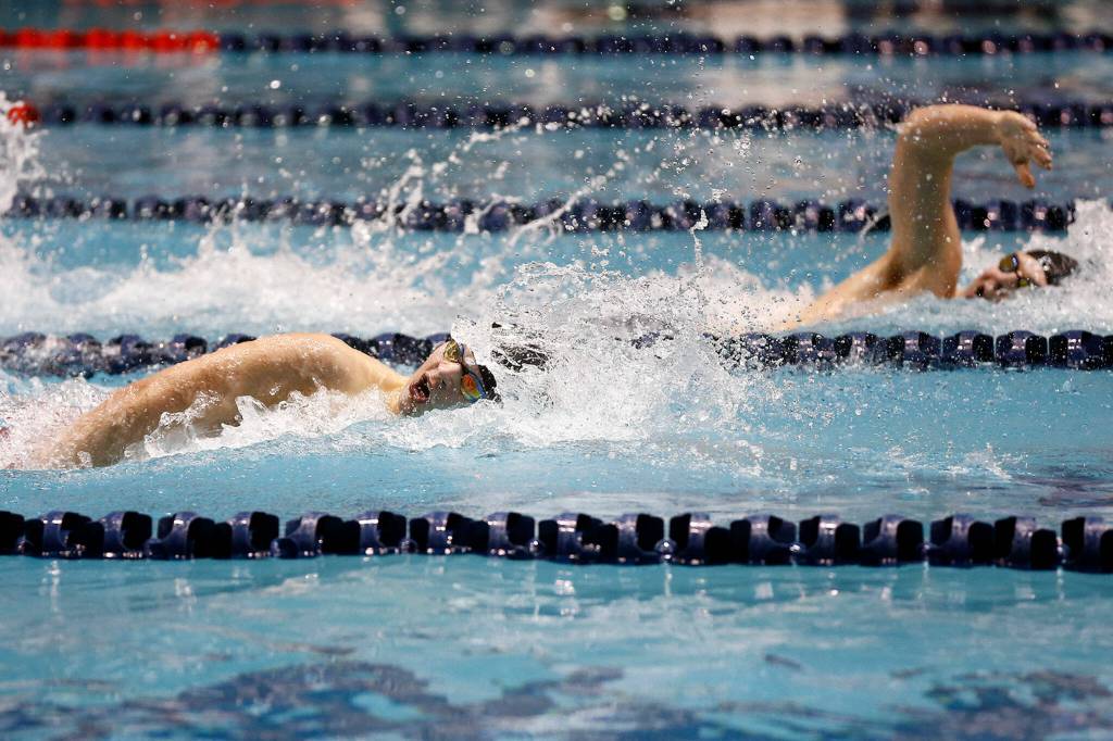 Jacksons Jensen Elsemore competes in the 200 yard freestyle during the WIAA 4A Boys Swimming Championship on Saturday at the King County Aquatic Center in Federal Way. (Ryan Berry / The Herald)