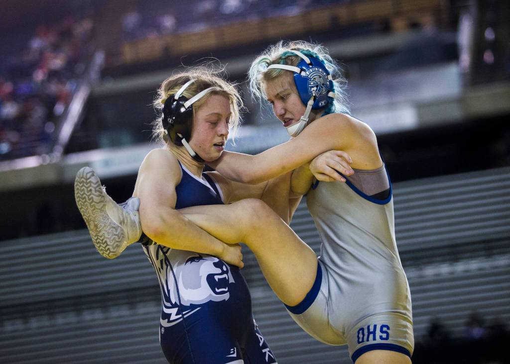 Glacier Peaks Karianne Baldwin wrestles Olympics Alexandrea Templeton in the Girls 125-pound championship match at the Mat Classic XXXIII on Saturday in Tacoma. (Olivia Vanni / The Herald)