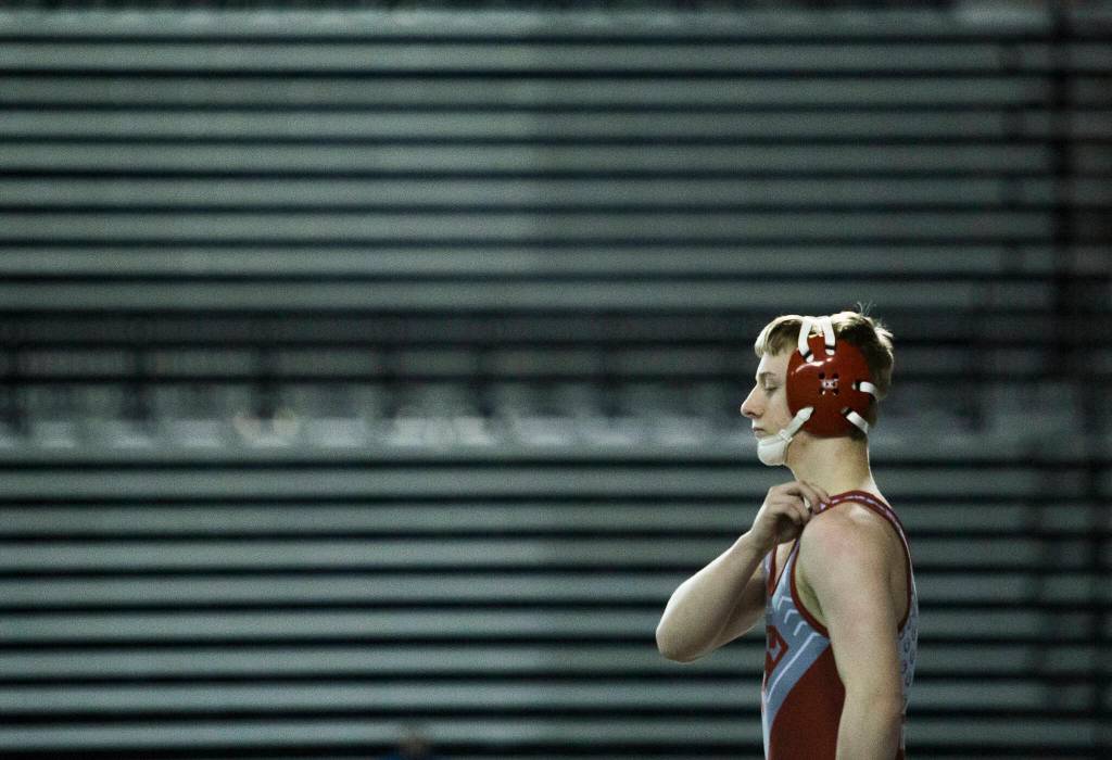 Stanwoods Tyler Rhue warms up before his match during the Mat Classic XXXIII on Saturday in Tacoma. (Olivia Vanni / The Herald)