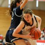 Everetts Emma Larson looks for a score with Meadowdales Gia Powell defending Saturday afternoon at during the 3A District Tournament at Everett Community College in Everett, Washington on February 19, 2022. (Kevin Clark / The Herald )