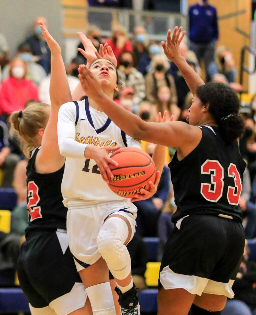 Everetts Alana Washington attempts a shot through Mountlake Terrace defense Friday evening in Everett, Washington on February 11, 2022. (Kevin Clark / The Herald)