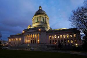 The Legislative Building is seen at dusk Tuesday, Feb. 15, 2022, following a session of the Legislature in Olympia, Wash. (AP Photo/Ted S. Warren)