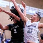 Jackson's Sylas Williams wins a rebound against Glacier Peak's Torey Watkins Friday evening at Glacier Peak High School in Snohomish, Washington on January 21, 2022. The Grizzles won 57-54. (Kevin Clark / The Herald)