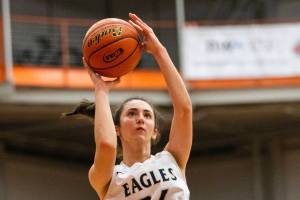 Arlington’s Jenna Villa makes a jump shot during the game against Kelso on Friday, Feb. 25, 2022 in Everett, Washington. (Olivia Vanni / The Herald)