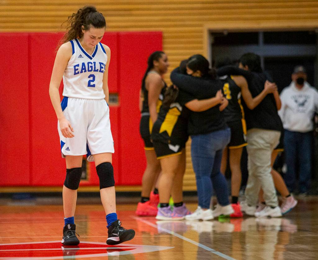 Grace Academys Zia Fackenthal hangs her head after losing to Cusick on Friday, Feb. 25, 2022 in Everett, Washington. (Olivia Vanni / The Herald)