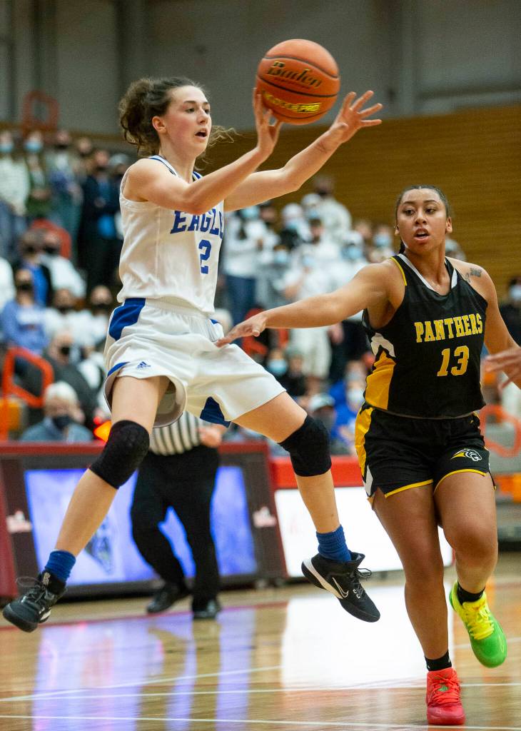 Grace Academys Zia Fackenthal jumps while making a pass during the game against Cusick on Friday, Feb. 25, 2022 in Everett, Washington. (Olivia Vanni / The Herald)