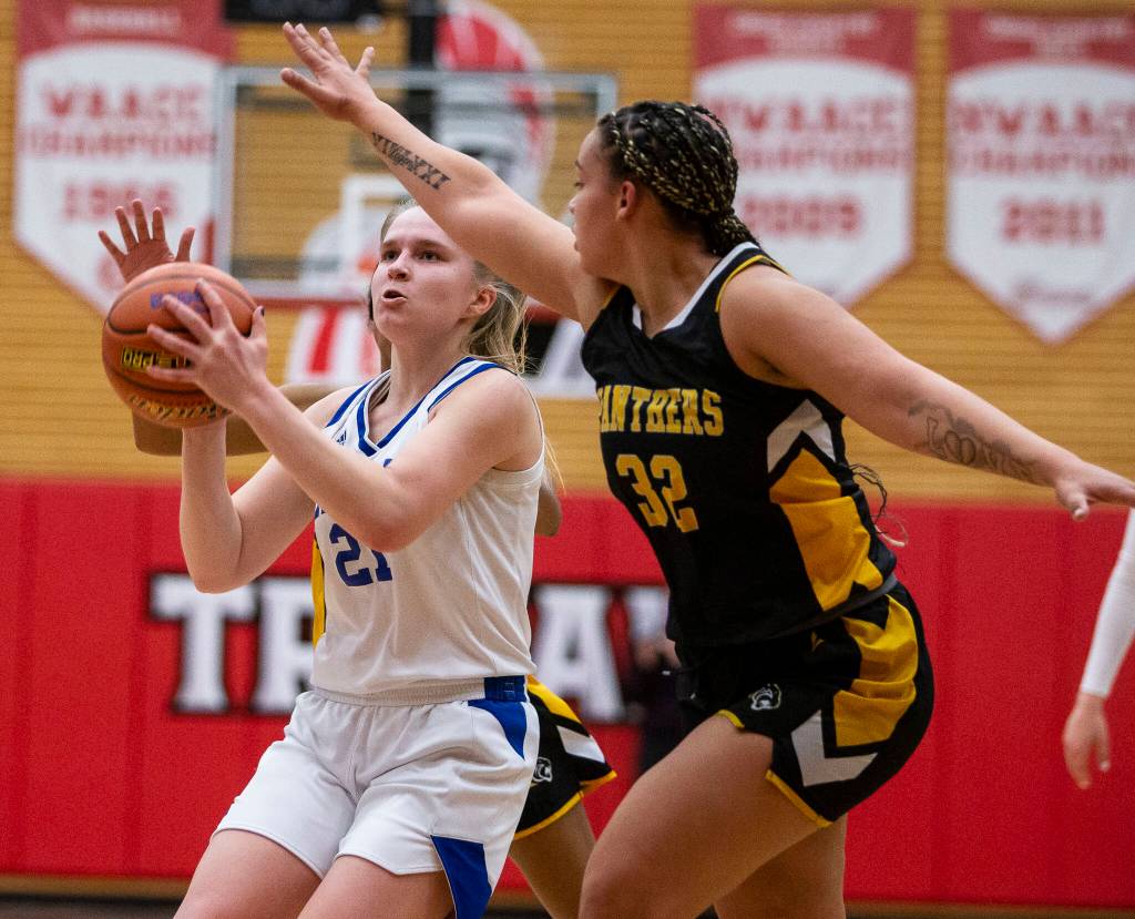 Grace Academys Heidi Impola drives to the hoop during the game against Cusick on Friday, Feb. 25, 2022 in Everett, Washington. (Olivia Vanni / The Herald)