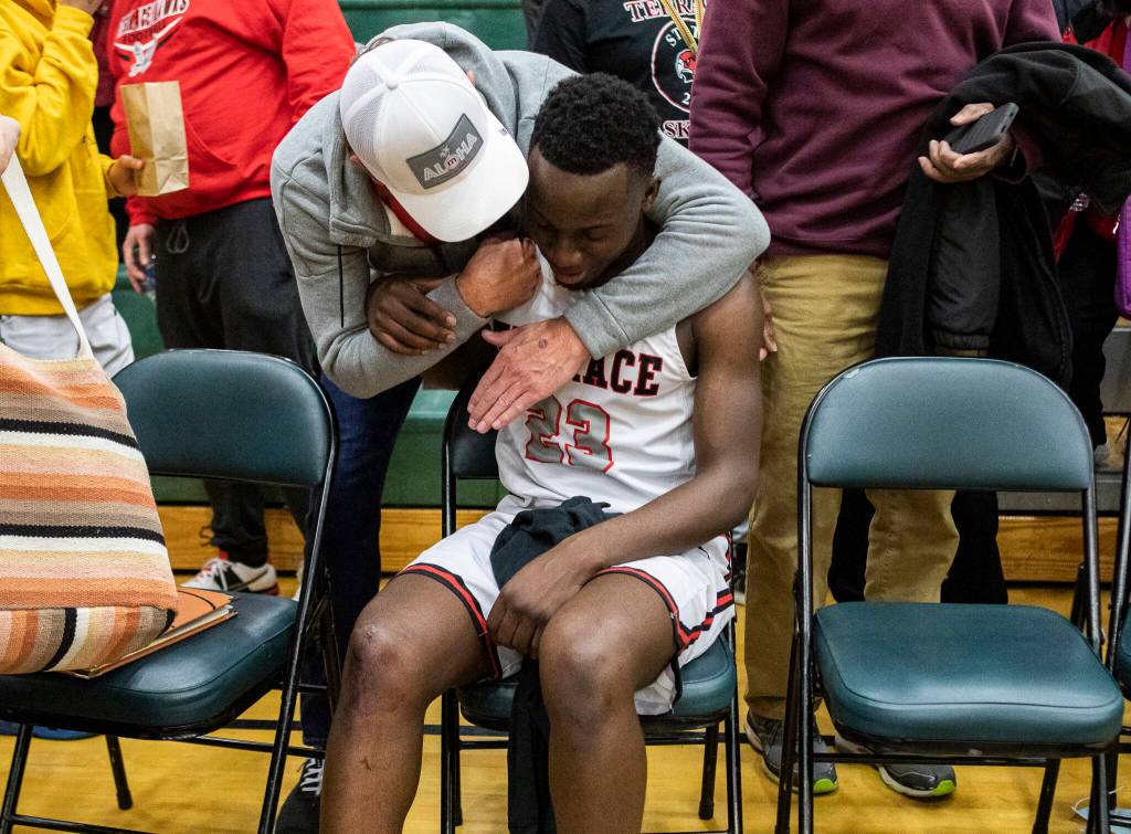 Mountlake Terraces Jeffrey Anyimah is congratulated on beating Kelso on Saturday, Feb. 26, 2022 in Mill Creek, Washington. (Olivia Vanni / The Herald)