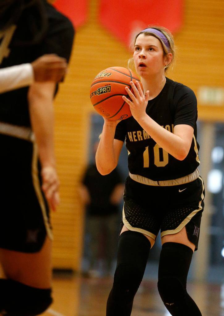 Hermistons Ellie Heideman squares up a shot before hitting a three against Everett Saturday, Feb. 26, 2022, during a Class 3A regional matchup at Everett Community College in Everett, Washington. (Ryan Berry / The Herald)