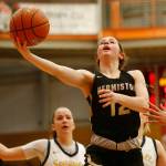 Hermiston’s Izzy Simmons puts in a late layup to tie the game against Everett Saturday, Feb. 26, 2022, during a Class 3A regional matchup at Everett Community College in Everett, Washington. (Ryan Berry / The Herald)