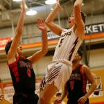 Lakewoods Justice Taylor goes for an acrobatic layup against Sammamish Saturday, Feb. 26, 2022, during a Class 2A regional matchup at Everett Community College in Everett, Washington. (Ryan Berry / The Herald)