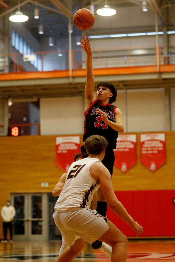 Sammamishs Levi Paskett scores with a floater against Lakewood Saturday, Feb. 26, 2022, during a Class 2A regional matchup at Everett Community College in Everett, Washington. (Ryan Berry / The Herald)