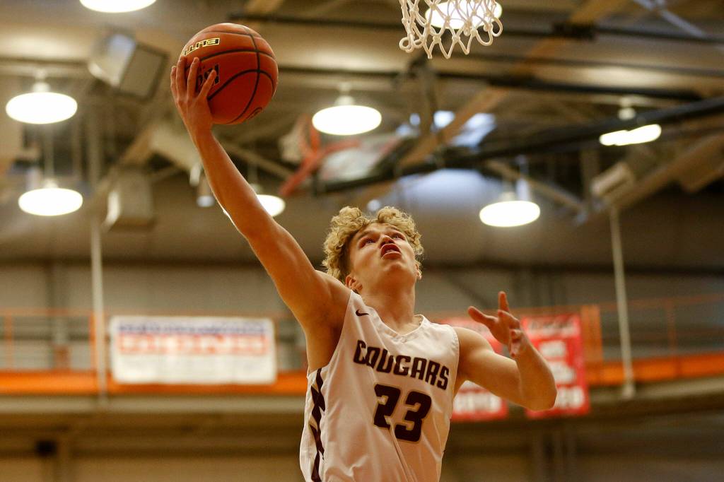 Lakewoods Dillon Wilson finishes off a layup in transition against Sammamish Saturday, Feb. 26, 2022, during a Class 2A regional matchup at Everett Community College in Everett, Washington. (Ryan Berry / The Herald)