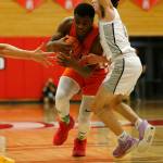 Graham-Kapowsins Elijah Cain tries to drive past a defender against Glacier Peak Saturday, Feb. 26, 2022, during a Class 4A regional matchup at Everett Community College in Everett, Washington. (Ryan Berry / The Herald)