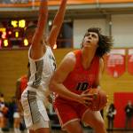 Graham-Kapowsins Gabriel Rzany turns to the basket before scoring against Glacier Peak Saturday, Feb. 26, 2022, during a Class 4A regional matchup at Everett Community College in Everett, Washington. (Ryan Berry / The Herald)