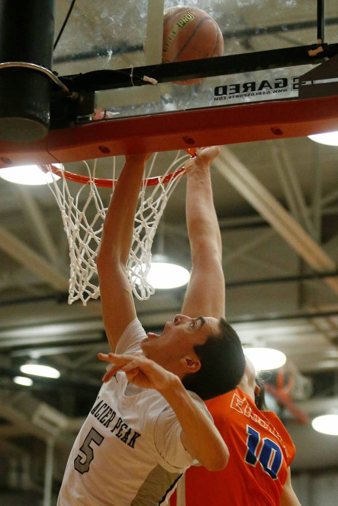 Glacier Peaks AJ Cline puts the ball in the basket against Graham-Kapowsin Saturday, Feb. 26, 2022, during a Class 4A regional matchup at Everett Community College in Everett, Washington. (Ryan Berry / The Herald)