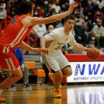 Glacier Peaks Paxton Bigby dribbles toward the net against Graham-Kapowsin Saturday, Feb. 26, 2022, during a Class 4A regional matchup at Everett Community College in Everett, Washington. (Ryan Berry / The Herald)