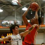 Graham-Kapowsin’s Joshua Wood scores over a defender against Glacier Peak Saturday, Feb. 26, 2022, during a Class 4A regional matchup at Everett Community College in Everett, Washington. (Ryan Berry / The Herald)
