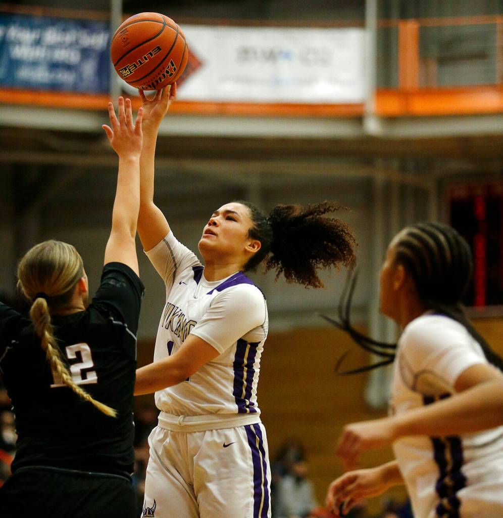 Lake Stevens Baylor Thomas shoots from the paint against Eastlake Saturday, Feb. 26, 2022, during a Class 4A regional matchup at Everett Community College in Everett, Washington. (Ryan Berry / The Herald)