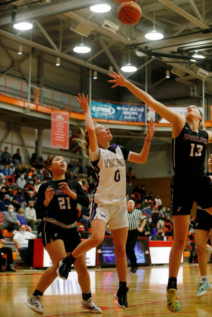 Lake Stevens Ella Edens connects on a close shot against Eastlake Saturday, Feb. 26, 2022, during a Class 4A regional matchup at Everett Community College in Everett, Washington. (Ryan Berry / The Herald)