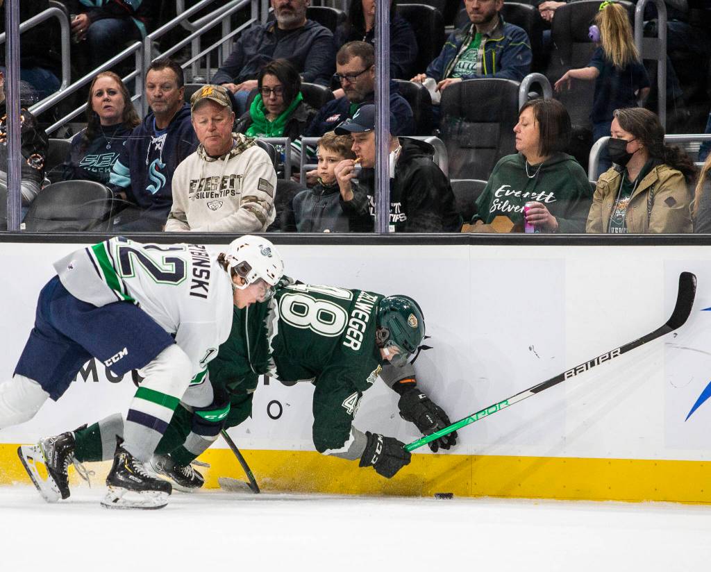Everett Silvertips Olen Zellweger is checked into the glass during the game against the Seattle Thunderbirds at Climate Pledge Arena on Saturday, Feb. 26, 2022 in Seattle, Washington. (Olivia Vanni / The Herald)