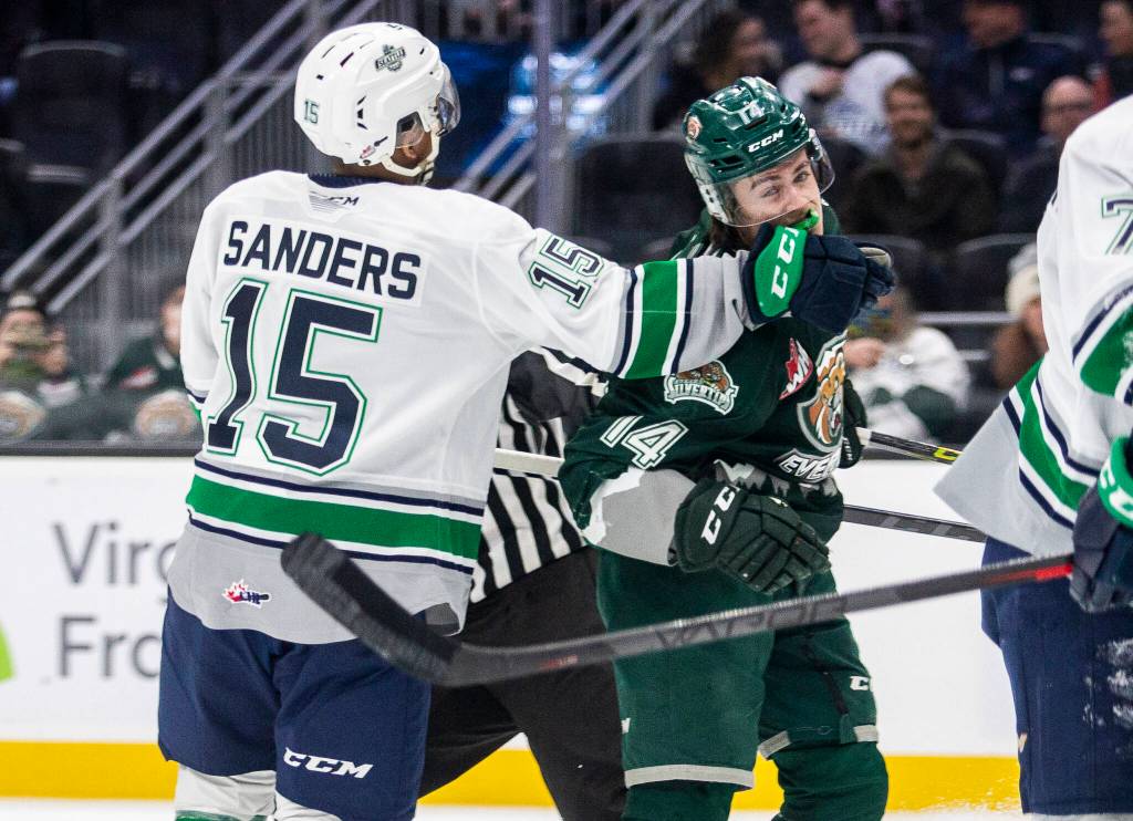 Everett Silvertips Austin Roest is punched by Seattle Thunderbirds Mekai Sanders during the game at Climate Pledge Arena on Saturday, Feb. 26, 2022 in Seattle, Washington. (Olivia Vanni / The Herald)