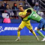 The Seattle Sounders Xavier Arreaga fights for the ball with Nashville SCs Hany Mukhtar during the opening game of the 2022 MLS season Sunday at Lumen Field in Seattle. (Ryan Berry / The Herald)