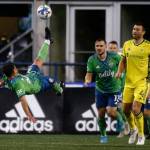 The Seattle Sounders’ Nicolas Lodeiro bicycle kicks the ball out of harm’s way during the opening game of the 2022 season against Nashville SC on Sunday, Feb. 27, 2022, at Lumen Field in Seattle, Washington. (Ryan Berry / The Herald)