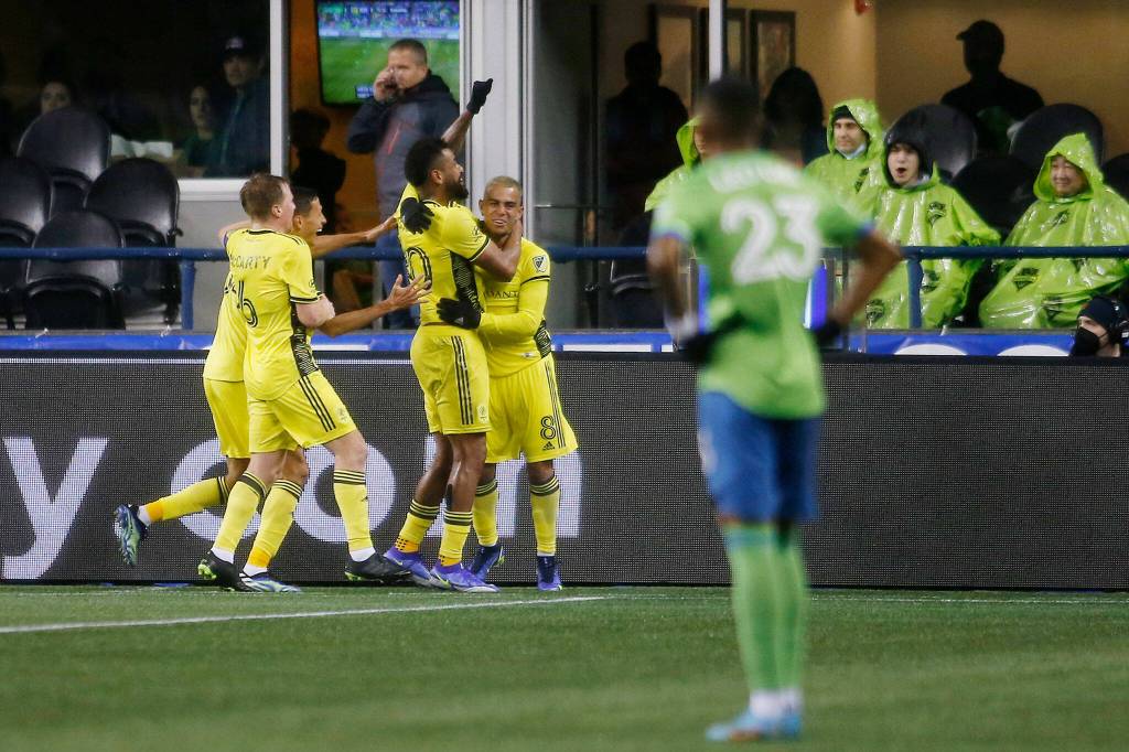 Nashville SC celebrates the lone goal of the game during the second half of the opening game of the 2022 season against Seattle on Sunday, Feb. 27, 2022, at Lumen Field in Seattle, Washington. (Ryan Berry / The Herald)